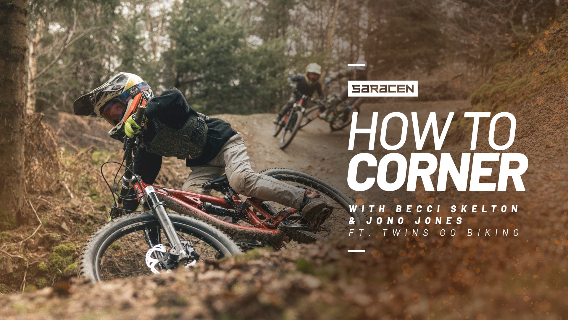 Two mountain bikers on a trail with 'Saracen' branding and text overlay about cornering techniques.