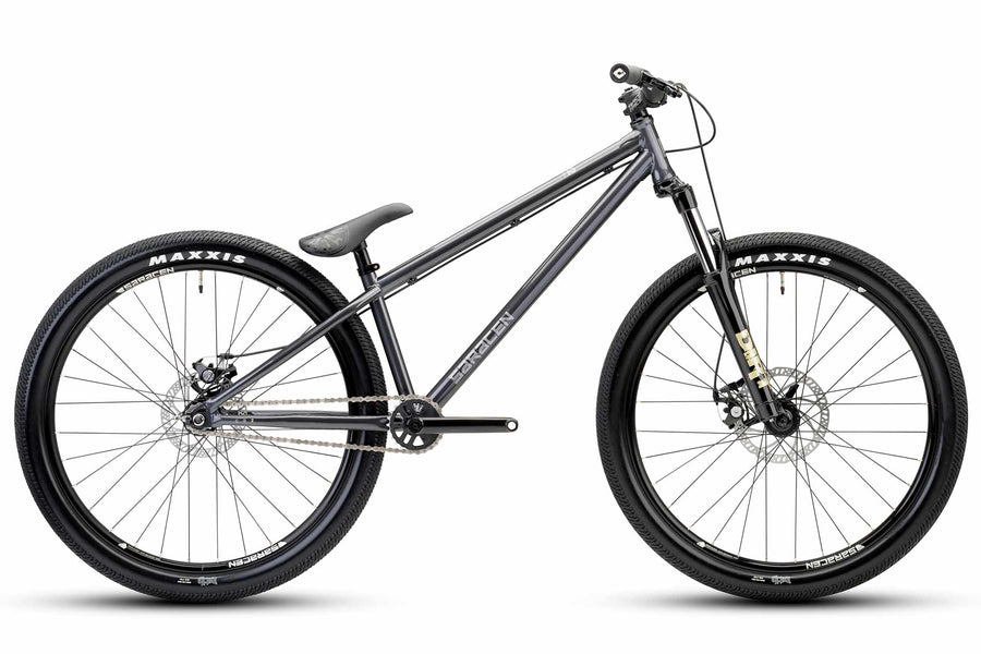A gray Amplitude CR2 mountain bike with a dirt jump setup, including a lightweight frame and rugged tires.
