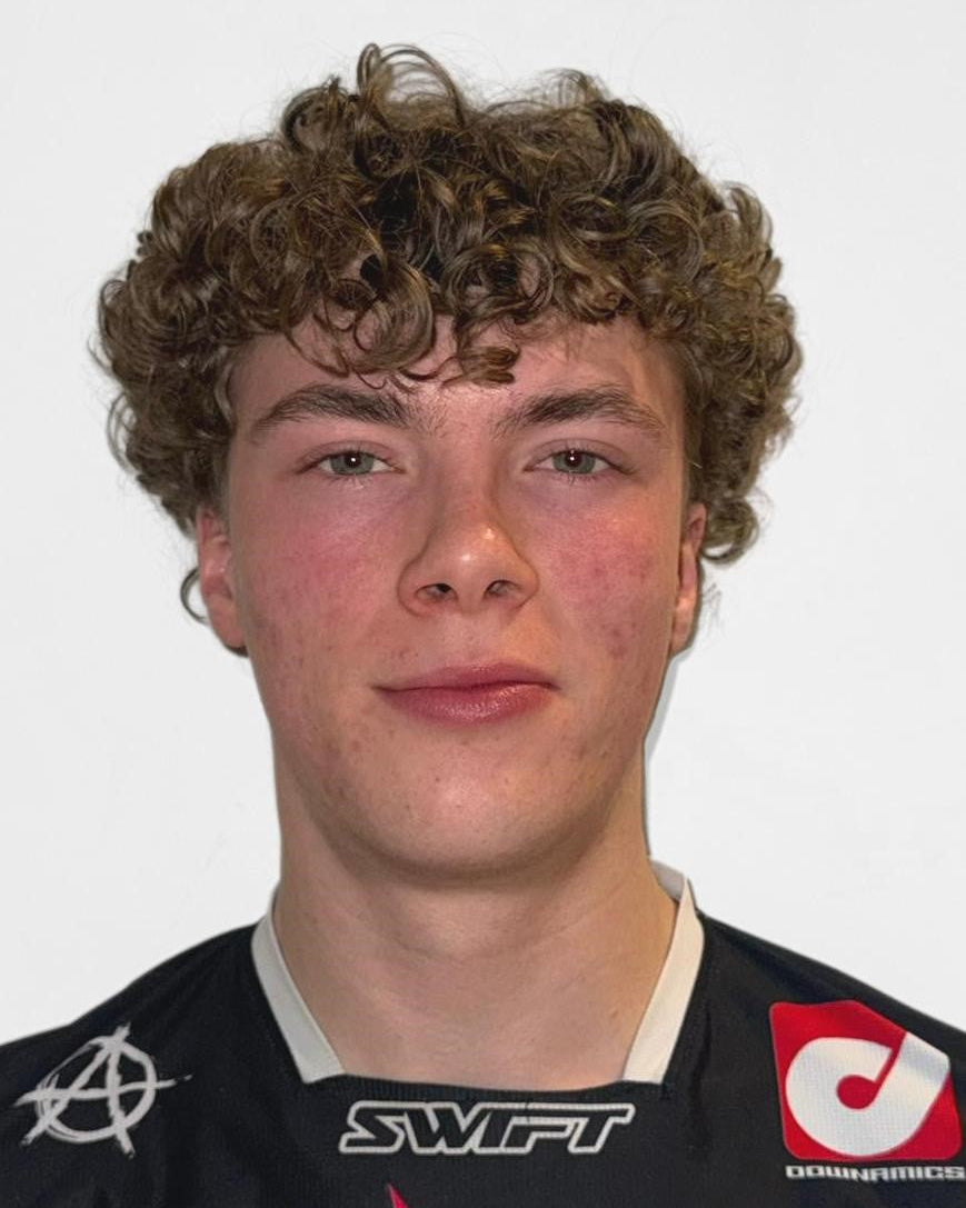 Person wearing a black sports jersey with visible branding on a white background