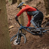 Person riding a mountain bike through a forest