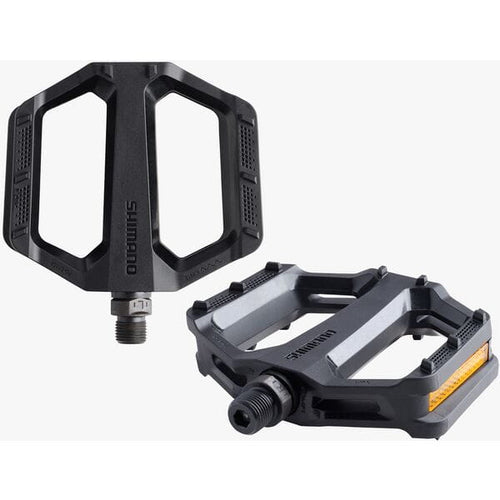 Two black bicycle pedals with Shimano branding on a white background